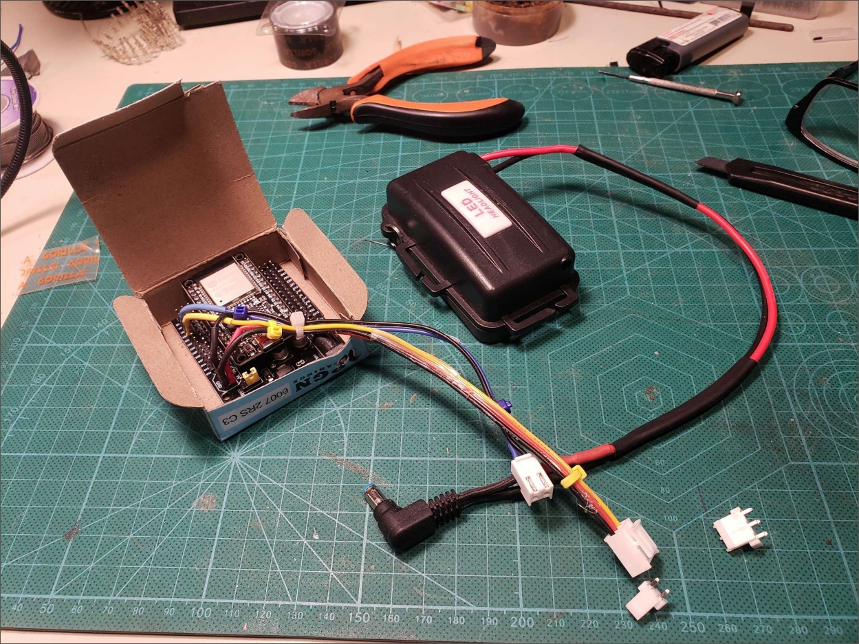 GearSense Mark I — dev board in a cardboard box with weatherproof enclosure alongside